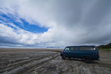 DocVan at the Beach in Oregon. buying a car to travel the USA
