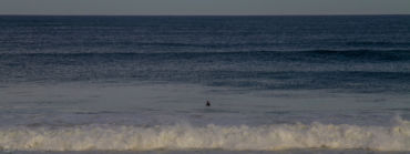 Lone surfer waiting for a wave. Razo, Galicia.