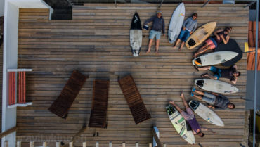 The crew gathered on the deck of the surfhouse.